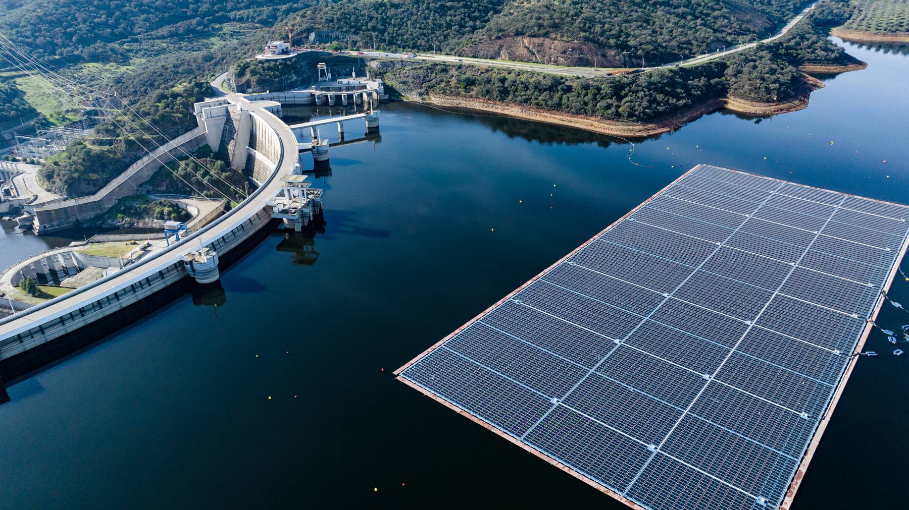 Floating solar panels on a reservoir beside a dam in southern Portugal